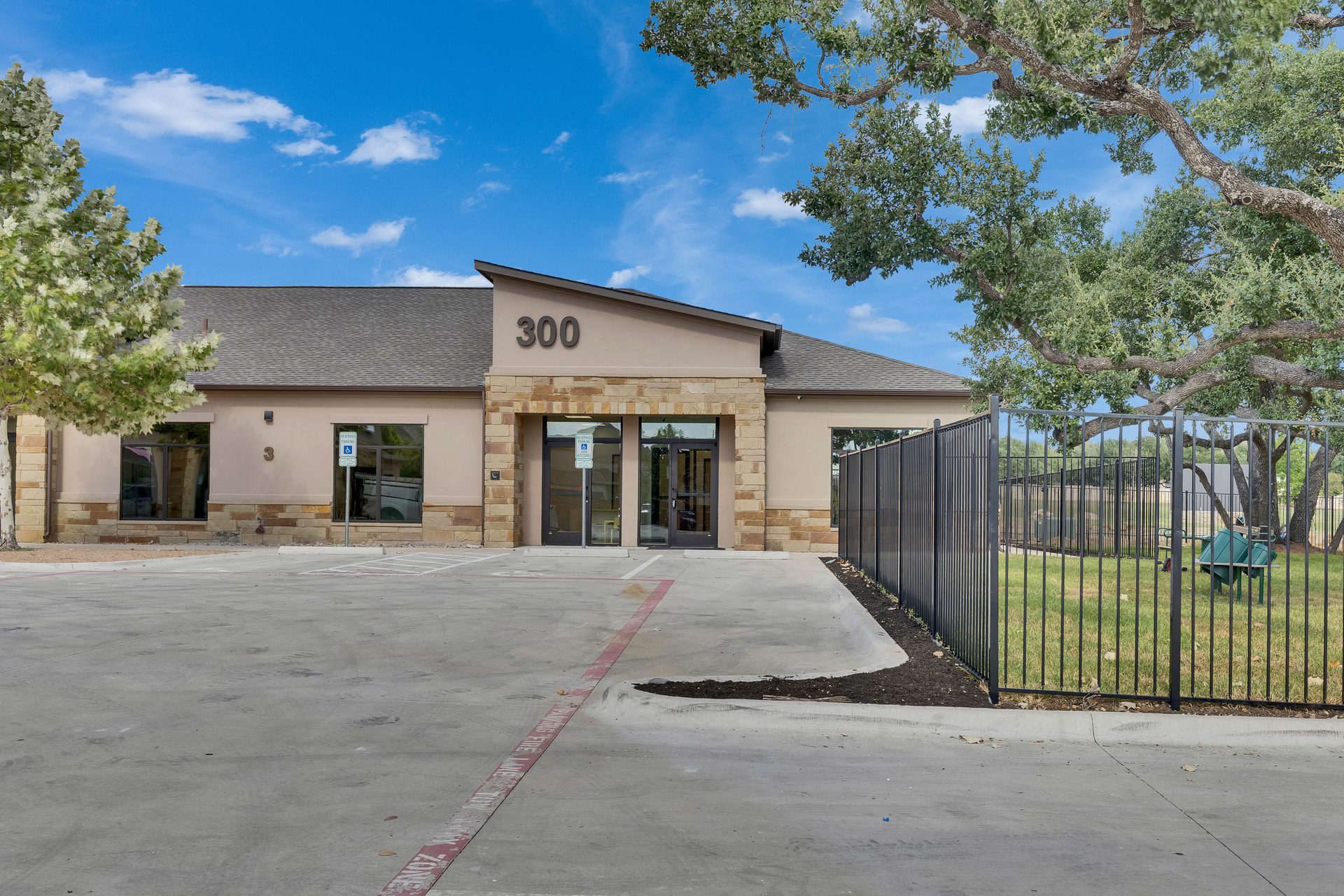 Building Kidz Daycare exterior with outdoor play area, Palmera Ridge, Leander, TX
