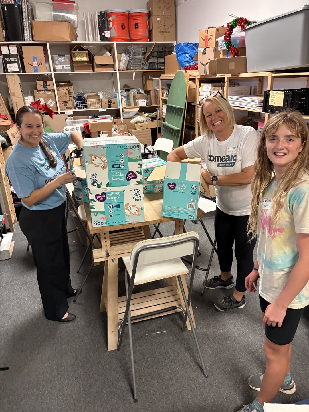 Volunteers bundling supplies for families at HomeAid Austin's Committee Care Day
