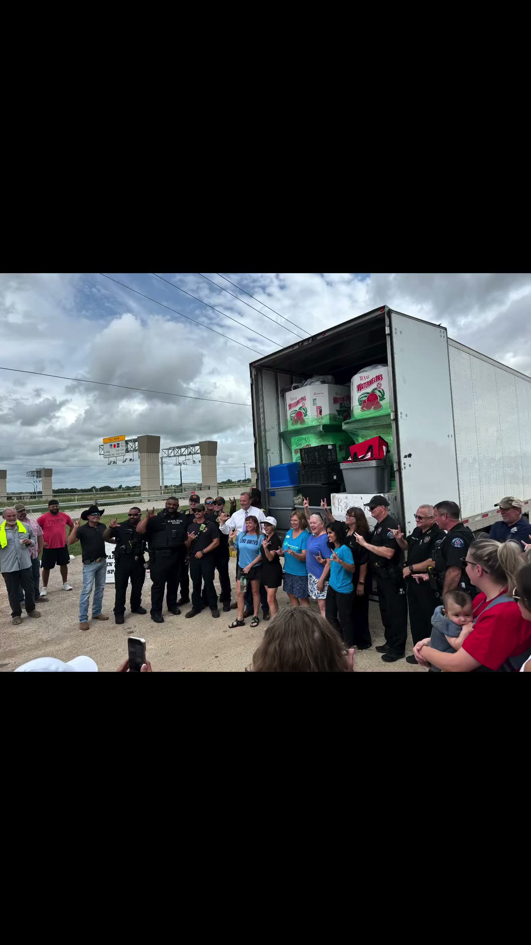 Local police, fire and neighbours gathered at the donation truck for the Operation Liberty Hill relief drive