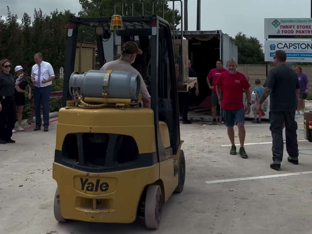 A forklift moving pallets of donated supplies at the Operation Liberty Hill relief drive