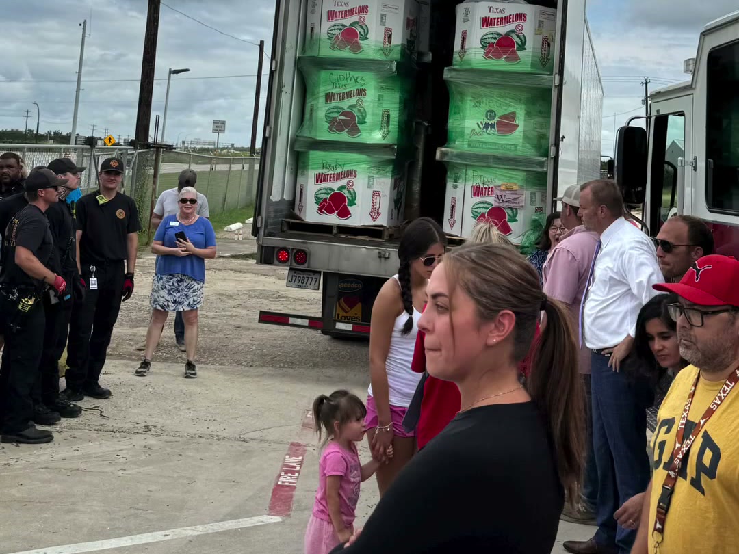 Neighbours, volunteers and local first responders gathered at the truck for the Operation Liberty Hill relief drive
