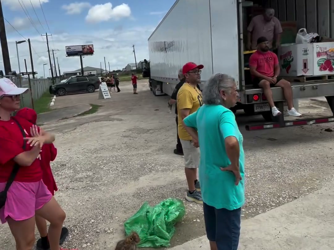 Volunteers unloading a semi-trailer of donated supplies for Operation Liberty Hill
