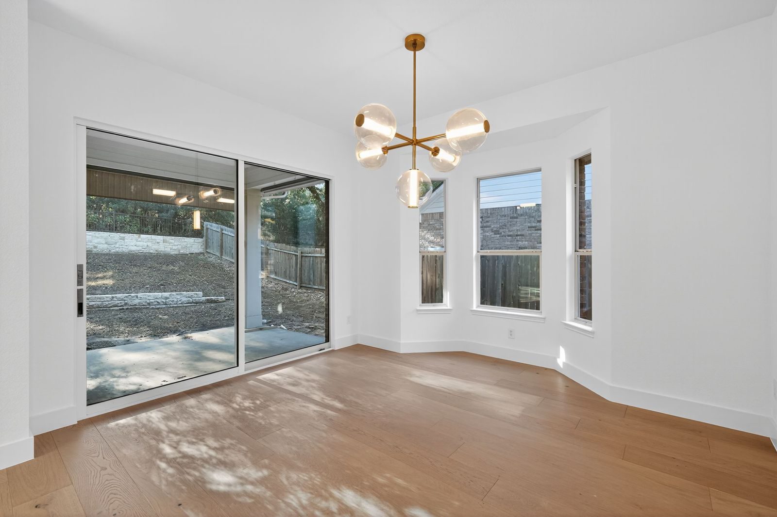 Along Creek Cove finished dining area with sliding door to backyard, Avery Ranch, Austin, TX