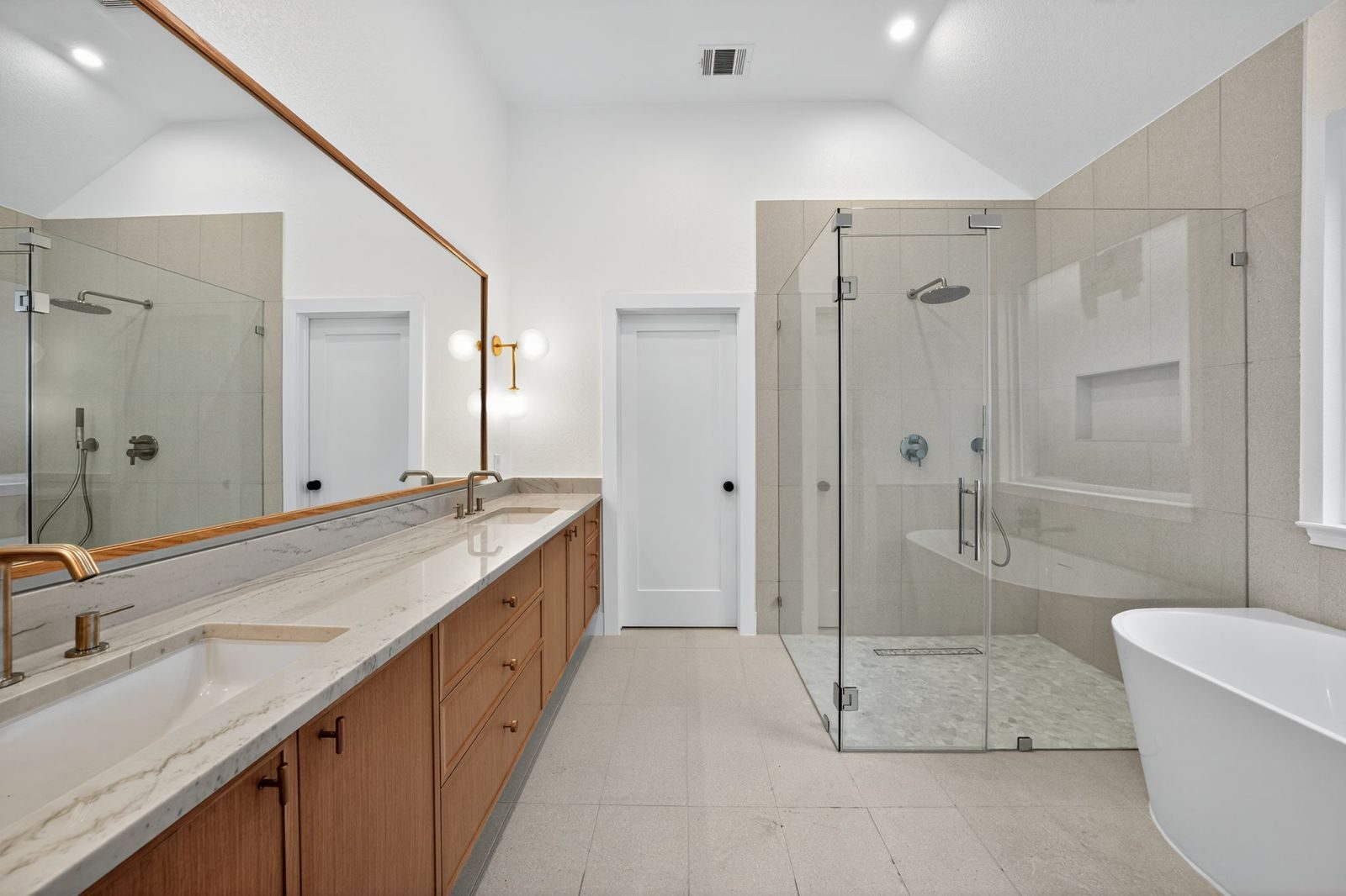 Along Creek Cove finished primary bathroom with soaking tub and glass shower, Avery Ranch, Austin, TX