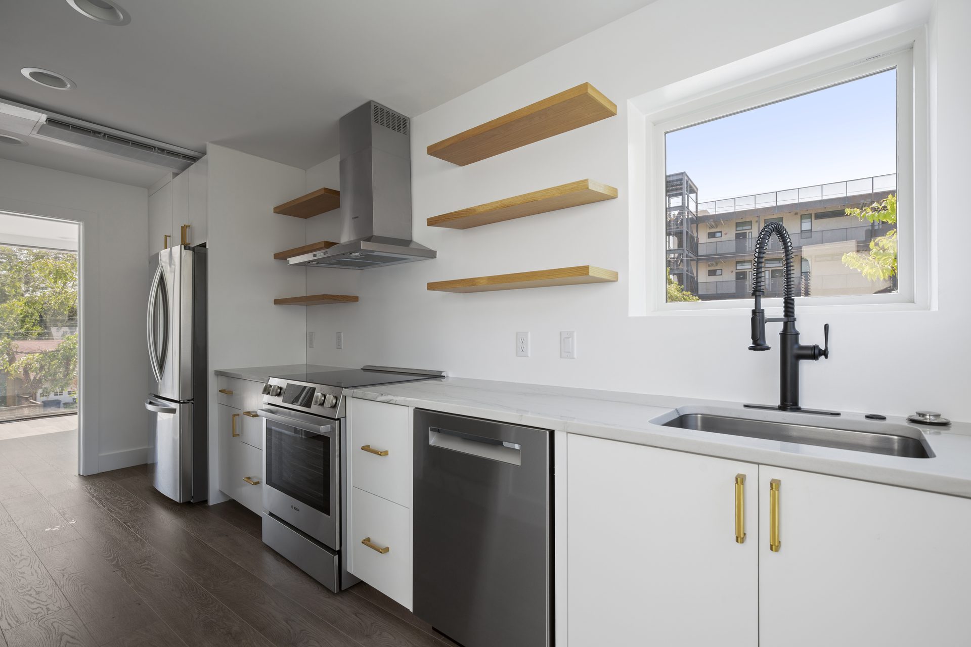 Rosewood custom new build, kitchen sink and city-view window, East Austin, TX