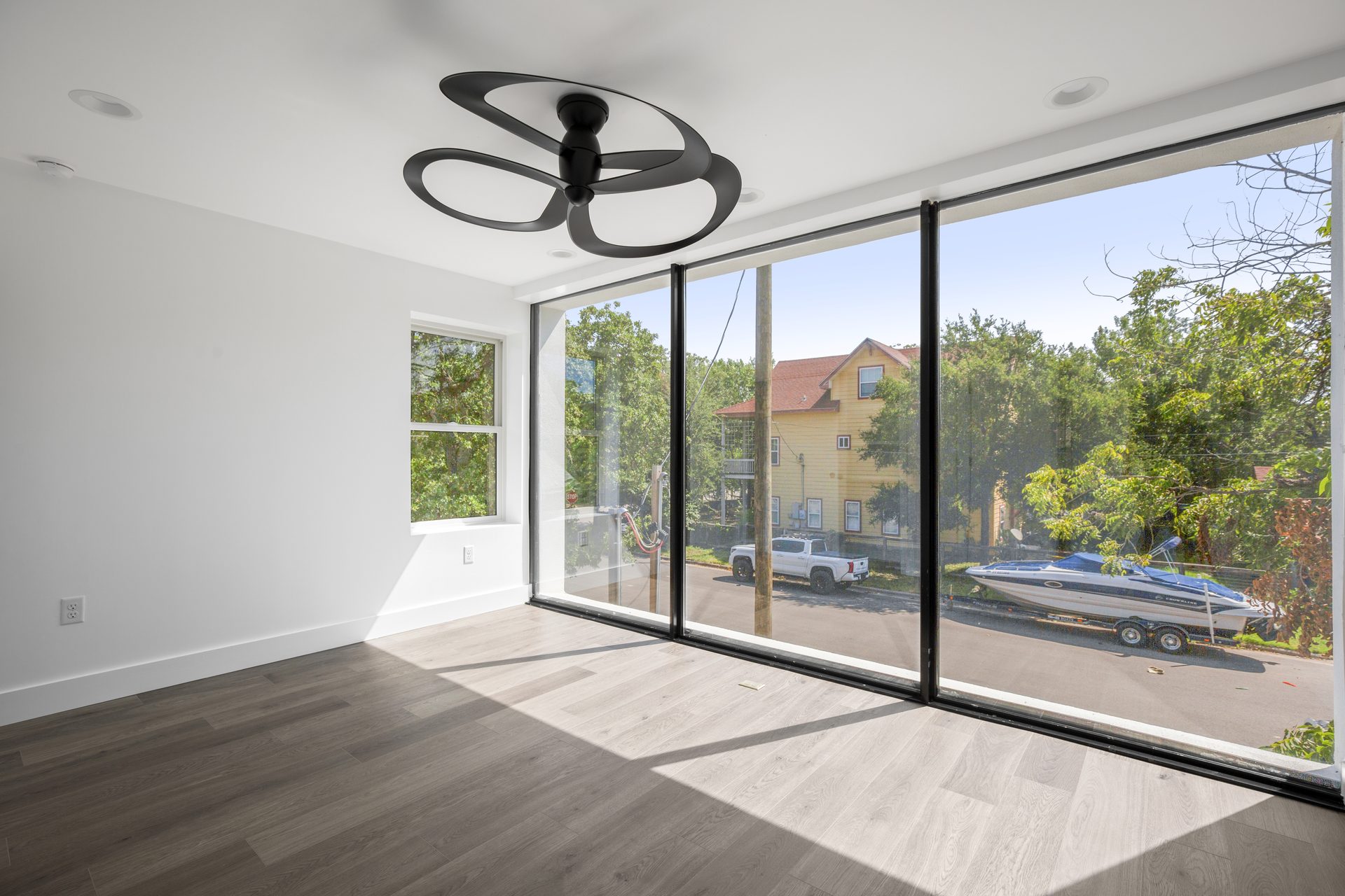 Rosewood custom new build, bright room with floor-to-ceiling glass wall, East Austin, TX