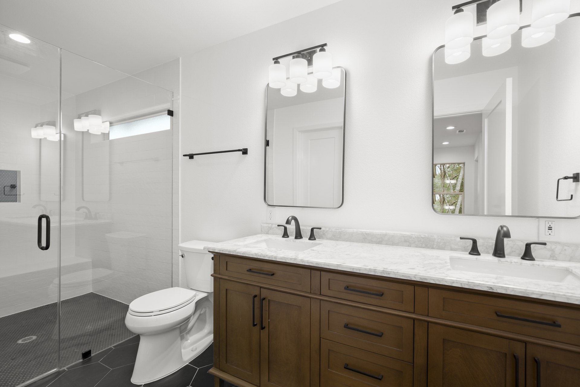 South Congress home addition, primary bathroom with glass shower and dual vanity, Austin, TX
