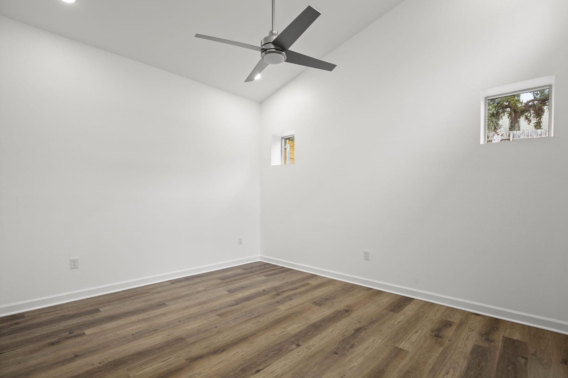 South Congress home addition, bedroom corner with ceiling fan, Austin, TX
