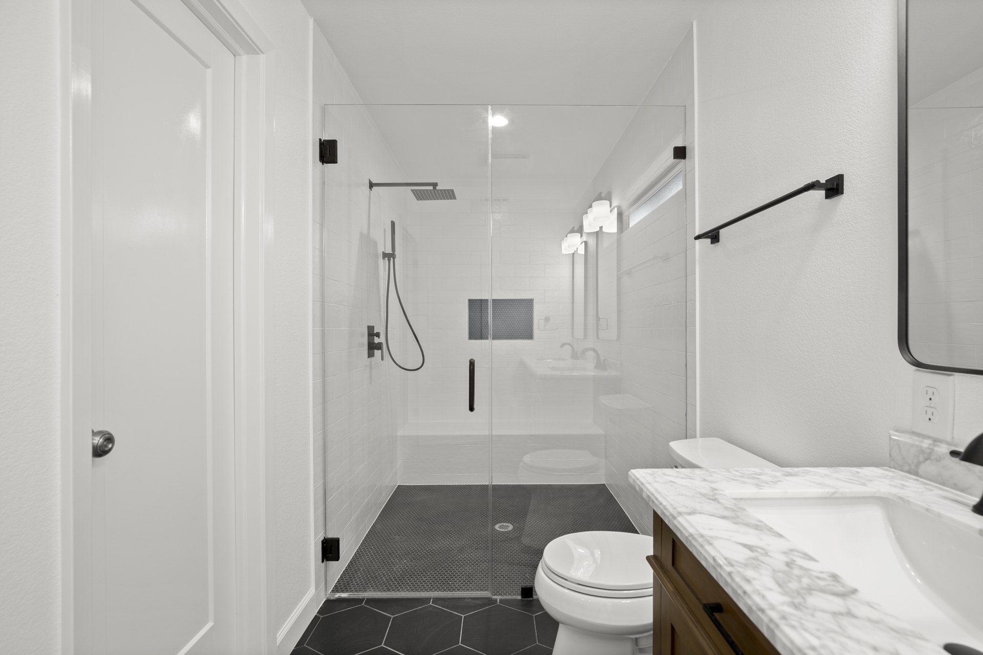 South Congress home addition, primary bathroom walk-in glass shower detail, Austin, TX