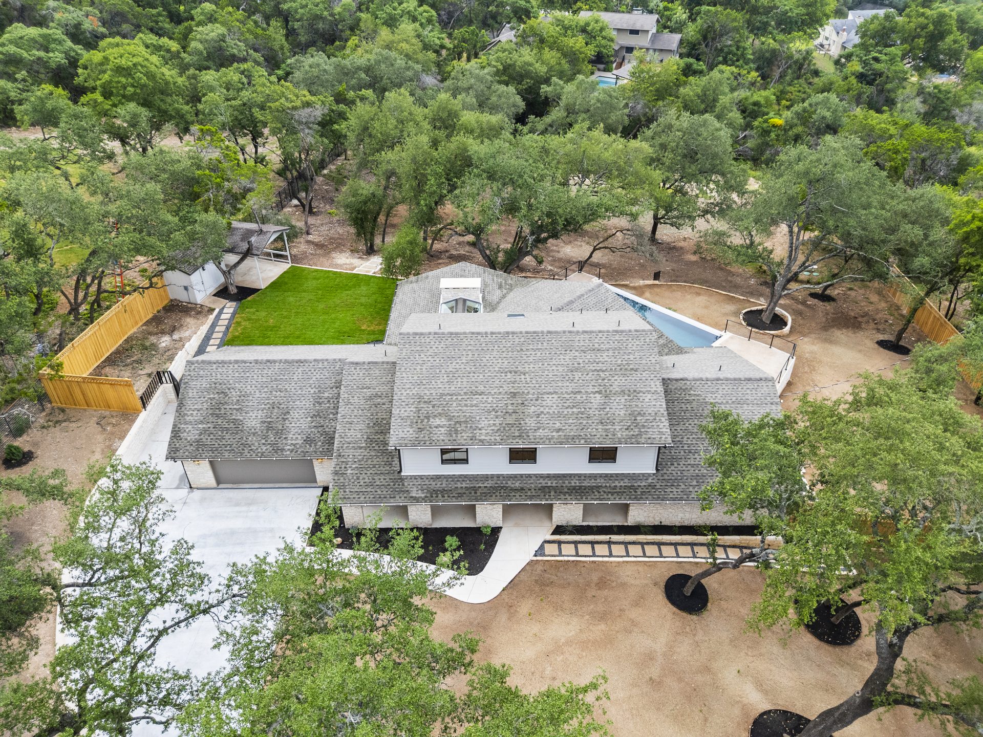 Castle Ridge aerial view of home and pool, Lost Creek, Austin, TX