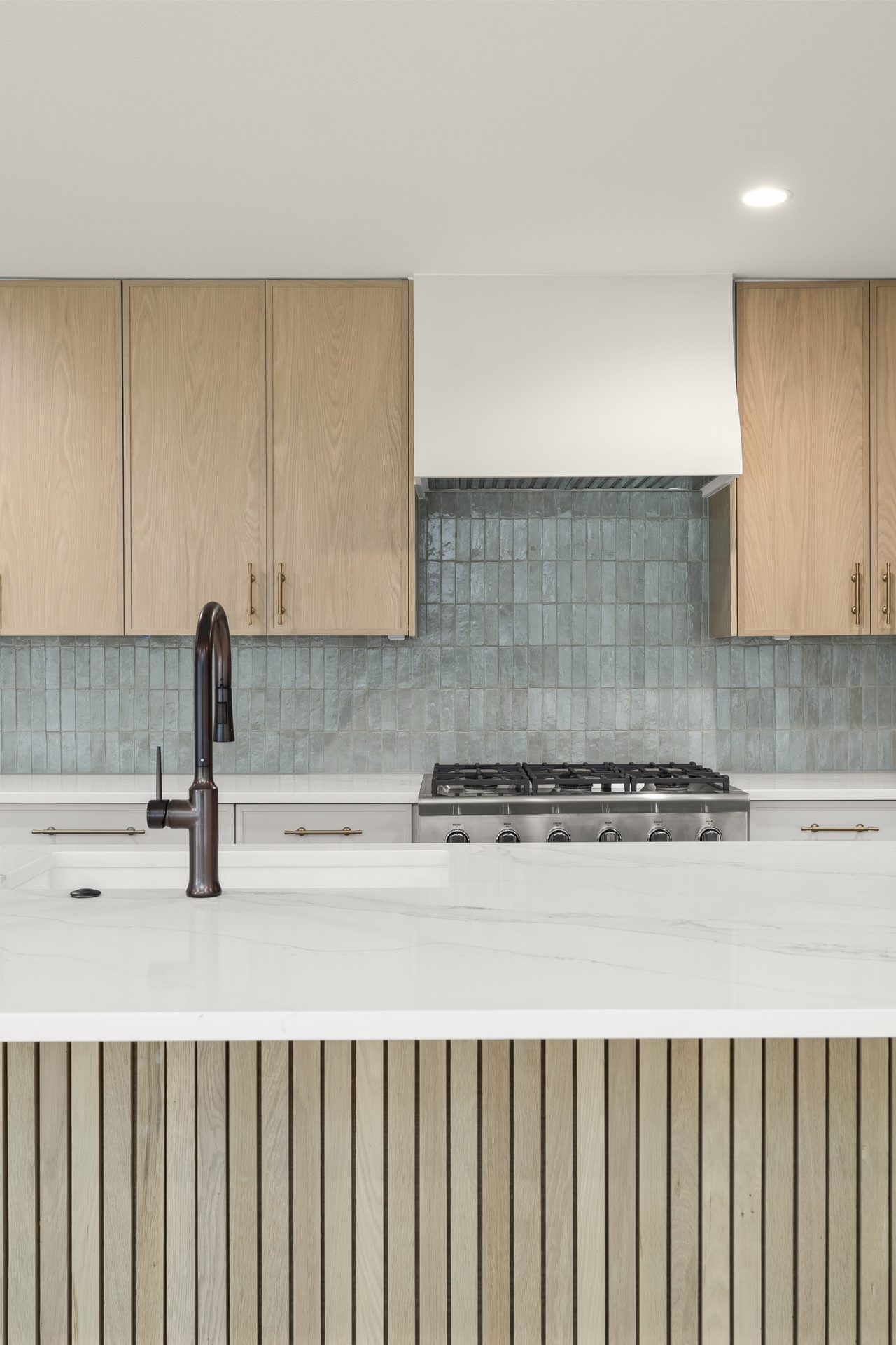 Castle Ridge finished kitchen island and gas range, Lost Creek, Austin, TX
