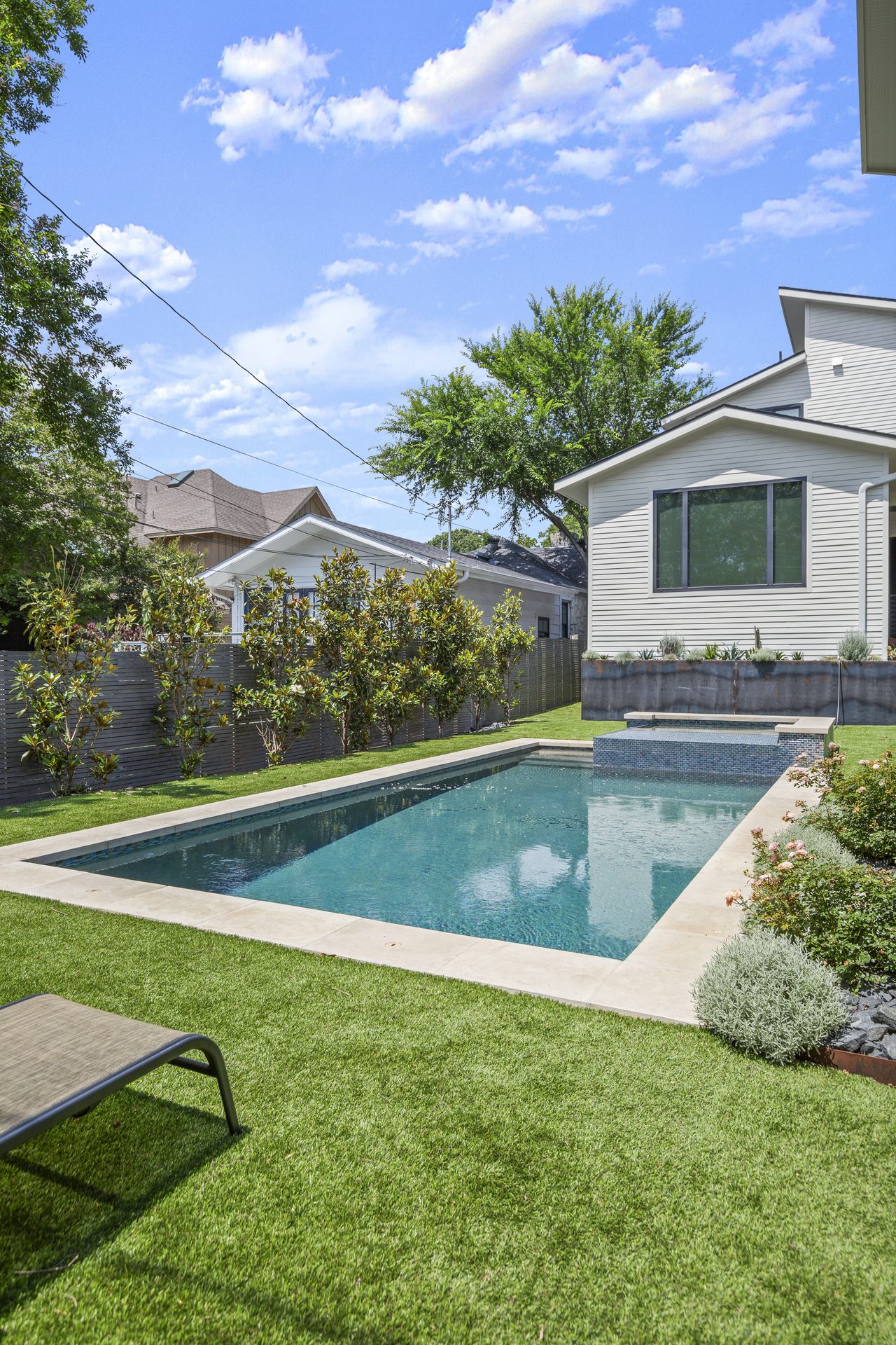 Tarrytown pool and outdoor living, wide view toward main house, Austin, TX