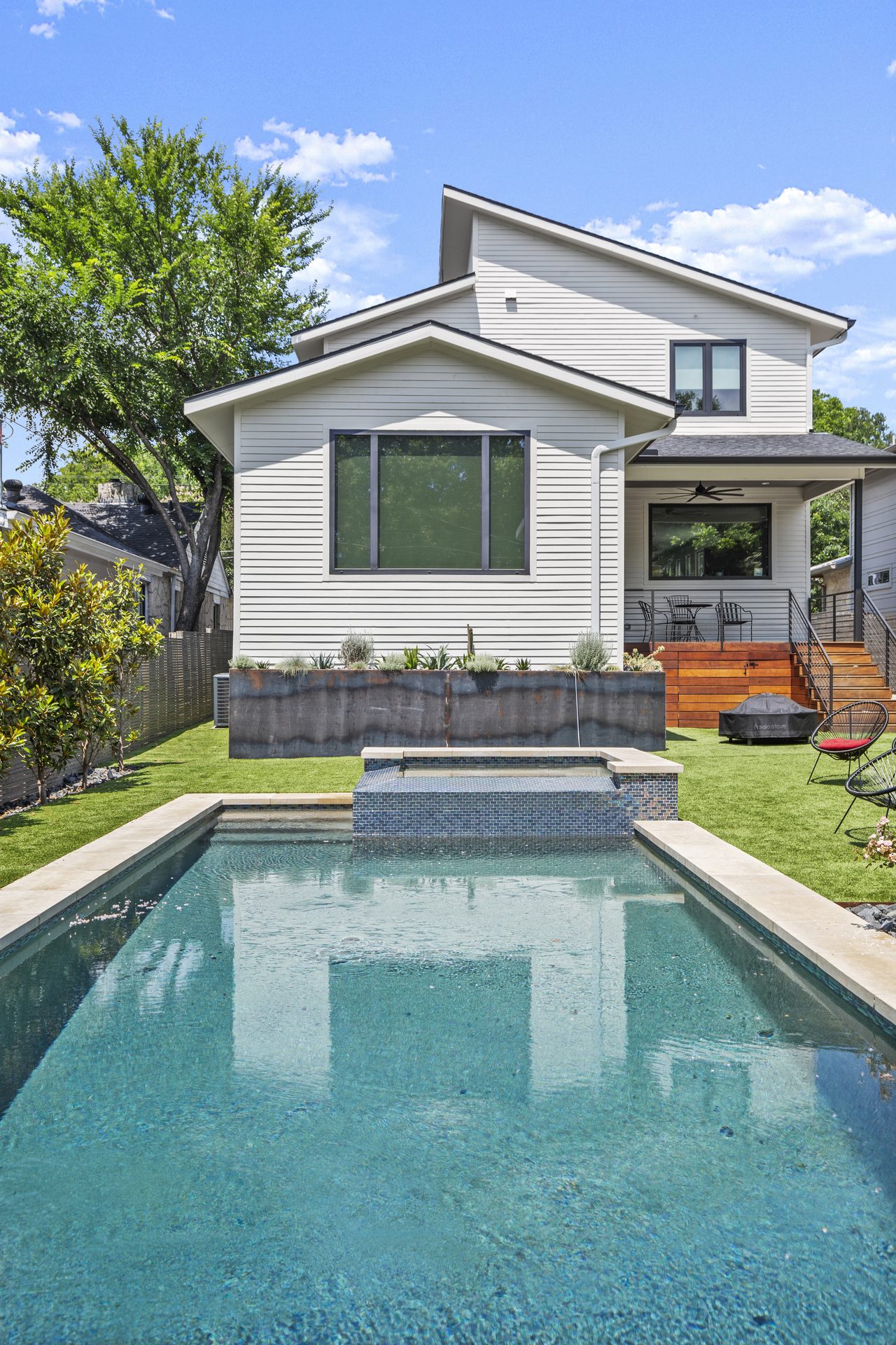Tarrytown pool and outdoor living, full home exterior with pool in foreground, Austin, TX