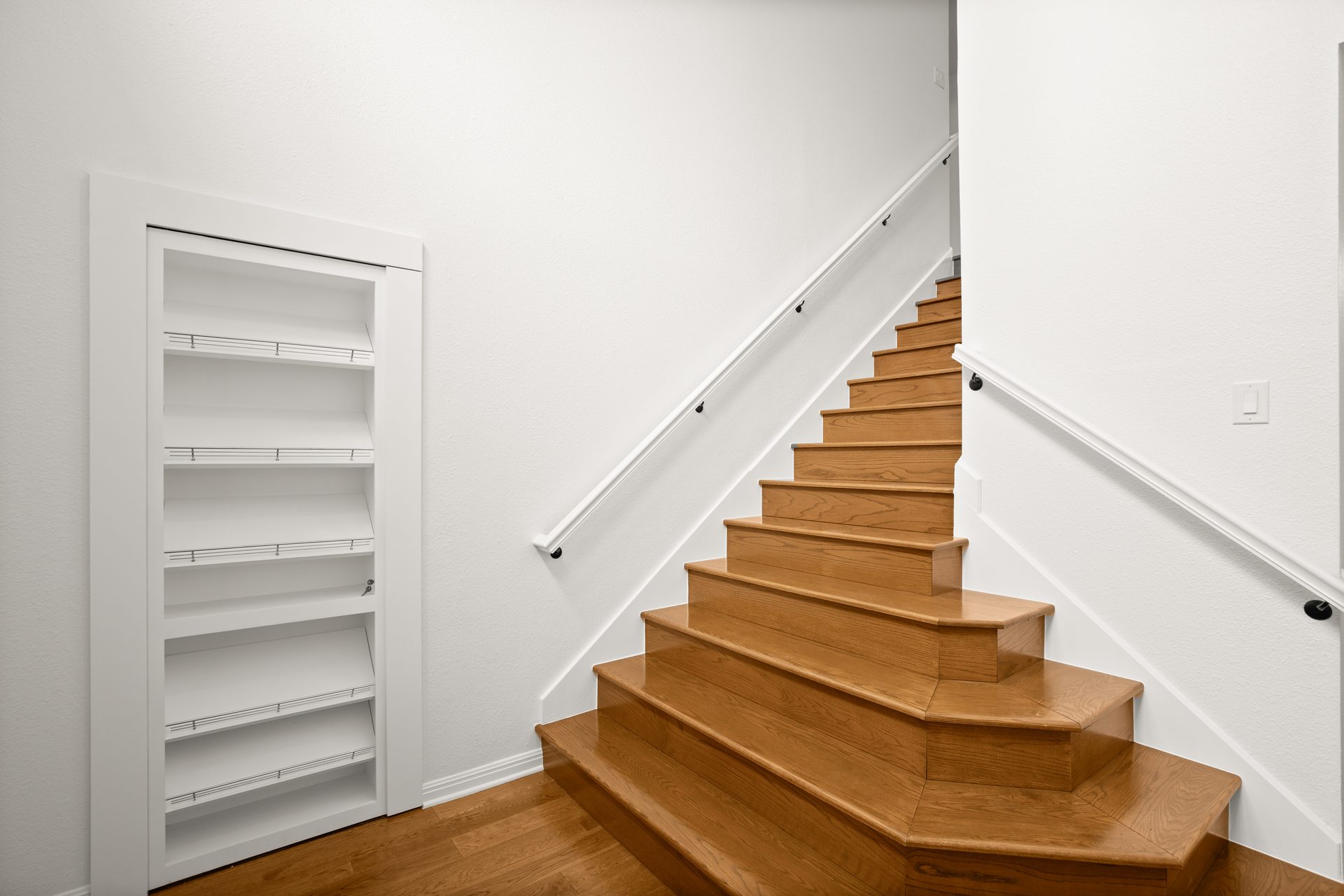 Anderson Mill (Los Indios) home renovation, staircase with built-in shelf nook, NW Austin, TX