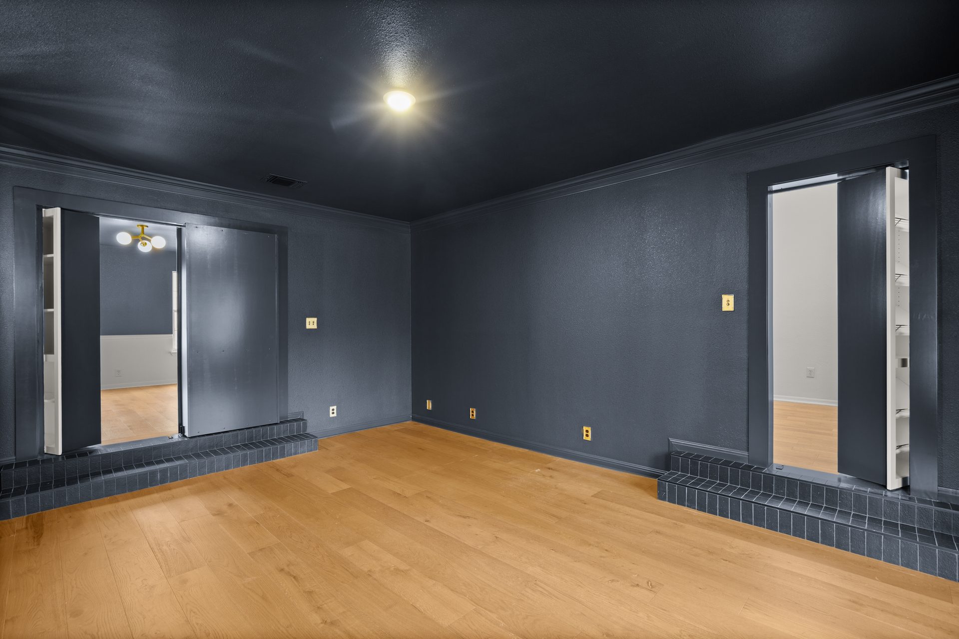 Anderson Mill (Los Indios) home renovation, charcoal media room with tile platform, NW Austin, TX