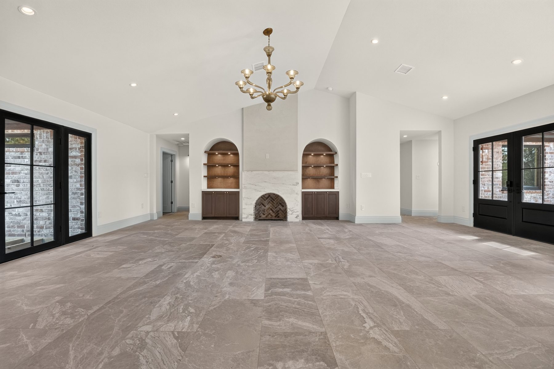 Open living area with vaulted ceiling and chandelier, North Austin, TX