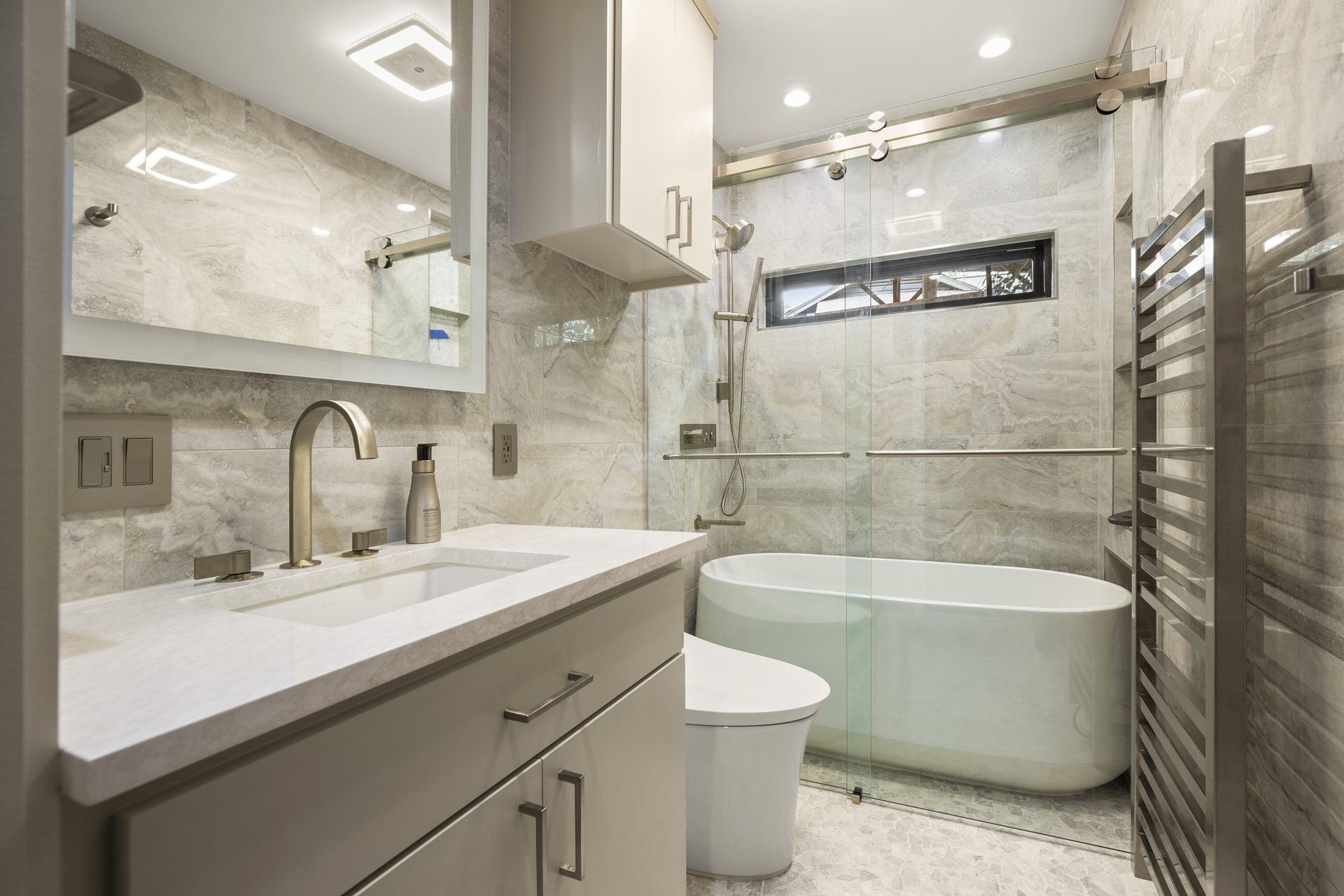 South Lamar bathroom remodel, full room view with soaking tub and glass shower, Austin, TX